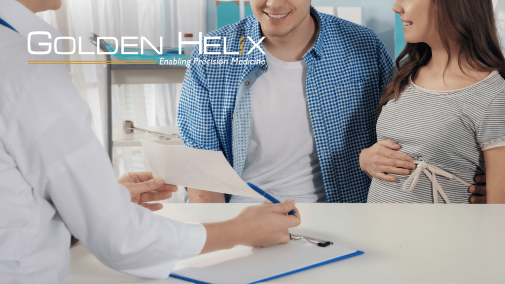 Pregnant couple consulting with doctor